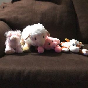 Stuffed farm animals . Sheep, cow, pigs
